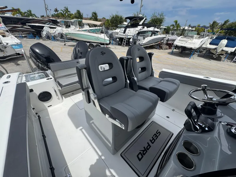 Slide: The Image of 2026 Sea Pro 292 DLX boat interior with dual seats and steering console. - 38