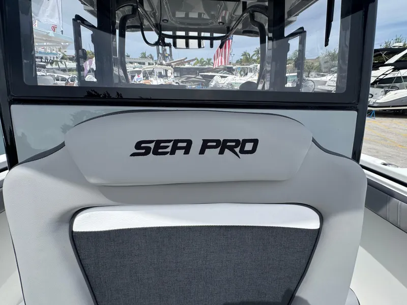 Slide: The Image of 2026 Sea Pro 292 DLX boat interior with logo on seat backrest. - 43