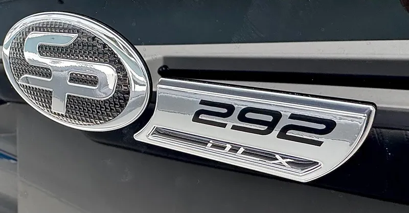 Slide: The Image of 2026 Sea Pro 292 DLX emblem on a sleek black surface. - 44