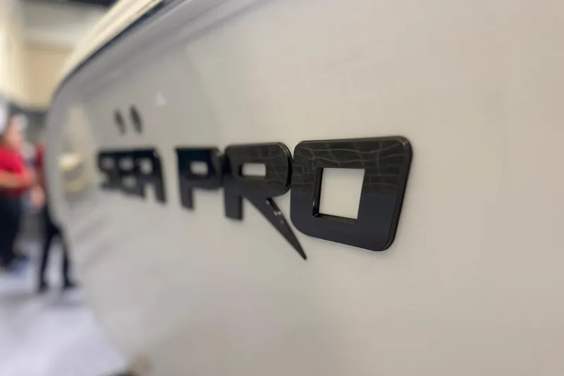 Slide: The Image of Close-up of 2026 Sea Pro 292 DLX logo on boat hull. - 93