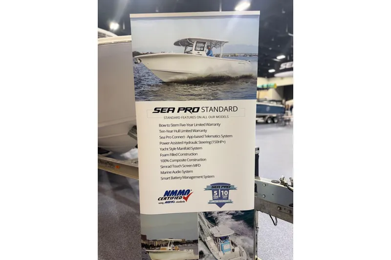 Slide: The Image of Banner showcasing 2026 Sea Pro 292 DLX boat features and warranty details at an exhibition. - 96