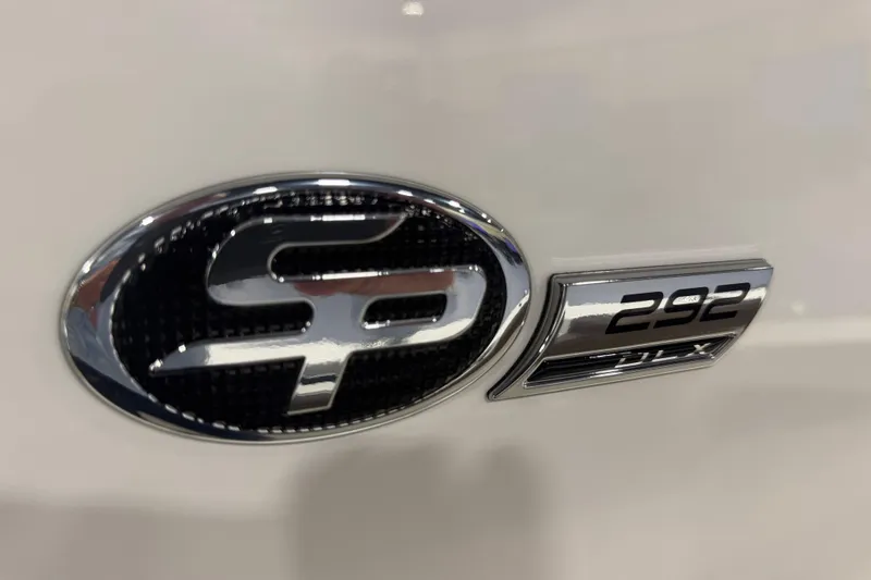 Slide: The Image of 2026 Sea Pro 292 DLX emblem on a sleek white surface. - 98