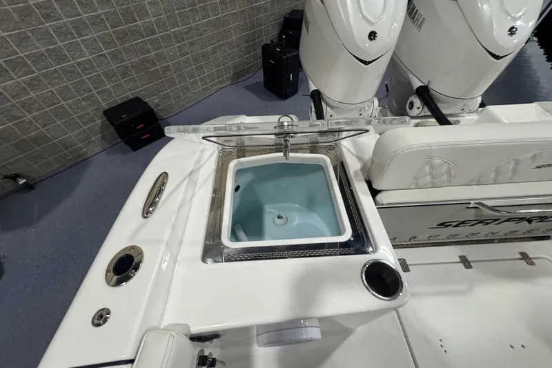 Slide: The Image of 2026 Sea Pro 332 DLX boat with livewell and dual Yamaha engines. - 16