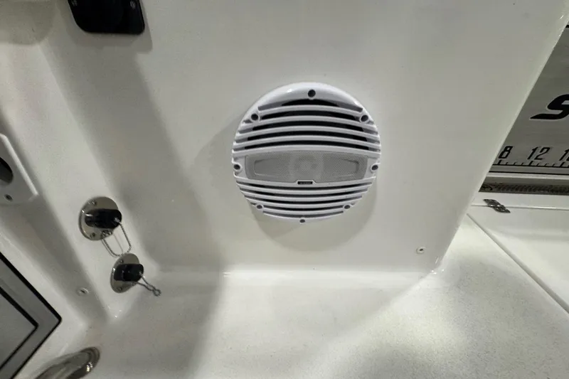 Slide: The Image of 2026 Sea Pro 332 DLX boat interior with speaker and control panel. - 17