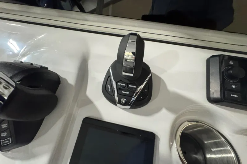 Slide: The Image of Control panel of 2026 Sea Pro 332 DLX boat with joystick and display. - 22