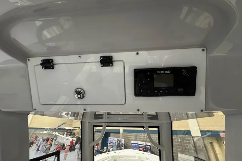 Slide: The Image of Interior view of 2026 Sea Pro 332 DLX boat with Simrad navigation system. - 28