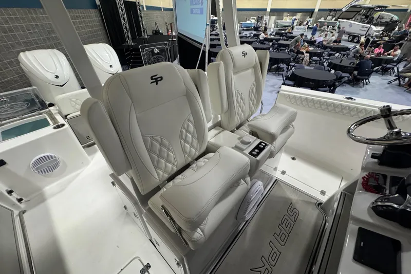 Slide: The Image of 2026 Sea Pro 332 DLX boat interior with luxurious seating and modern design. - 48