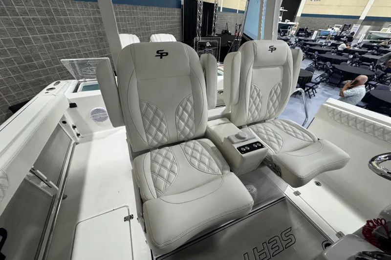 Slide: The Image of Luxurious seating on 2026 Sea Pro 332 DLX boat, featuring elegant white upholstery. - 54
