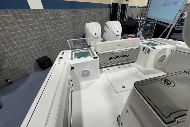 Slide: The Image of 2026 Sea Pro 332 DLX boat interior with dual engines and fishing features. - 55