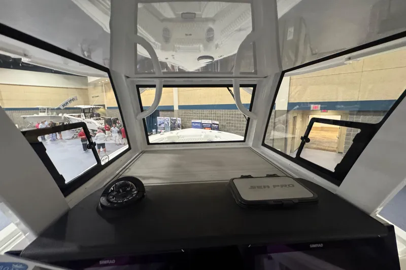 Slide: The Image of Interior view of 2026 Sea Pro 332 DLX boat at an indoor exhibition. - 61