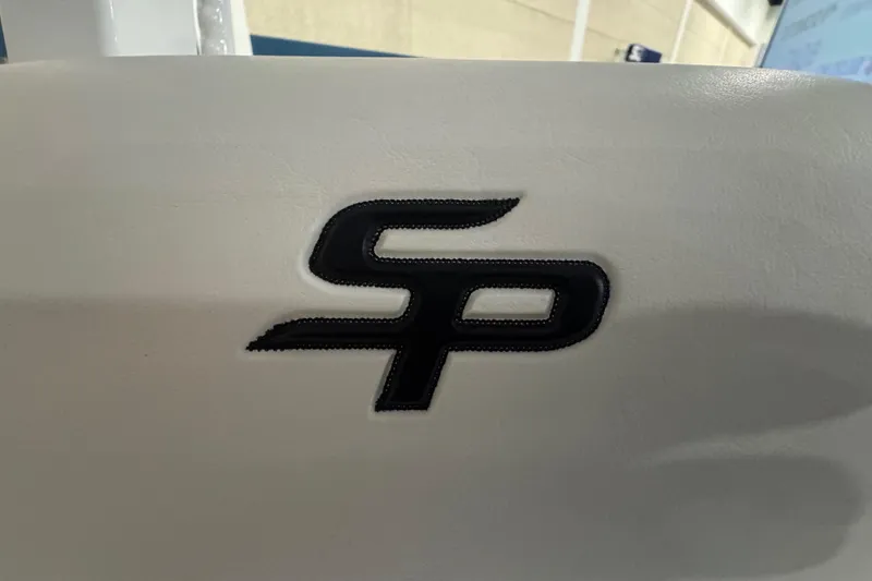 Slide: The Image of Sea Pro 332 DLX 2026 logo on white surface, close-up view. - 64