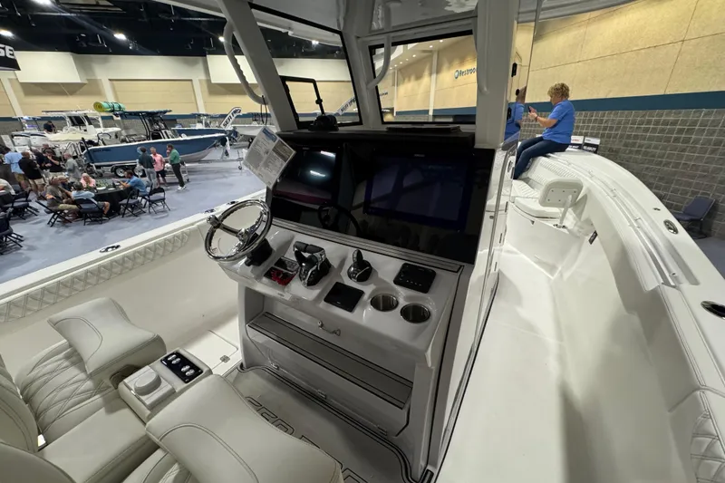 Slide: The Image of Interior view of 2026 Sea Pro 332 DLX boat at a boat show. - 8