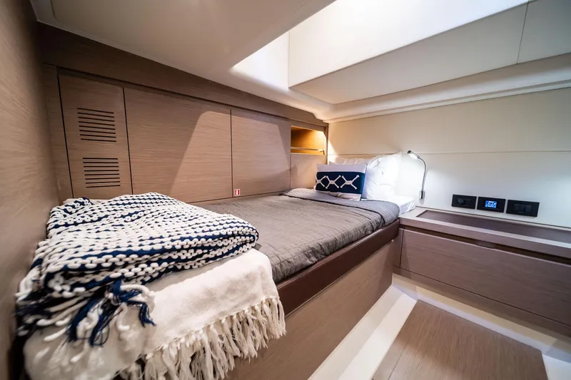 Slide: The Image of Luxurious cabin interior of 2024 Pardo Yachts P43, featuring cozy bedding and modern design. - 71