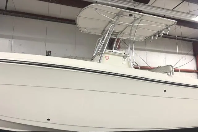 Slide: The Image of 2021 Cobia 237 Center Console boat in indoor storage facility. - 6