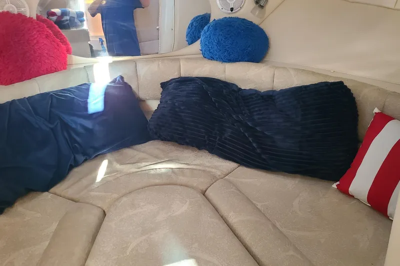 Slide: The Image of Interior of 2005 Aquasport 275 Explorer with colorful cushions and seating area. - 8