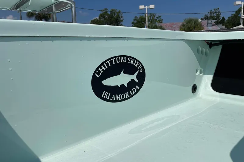 Slide: The Image of 2026 Chittum Skiffs Islamorada 18 with Yamaha outboard motor, displayed on a trailer. - 10