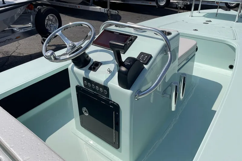 Slide: The Image of 2026 Chittum Skiffs Islamorada 18 boat, featuring sleek design and modern controls. - 13