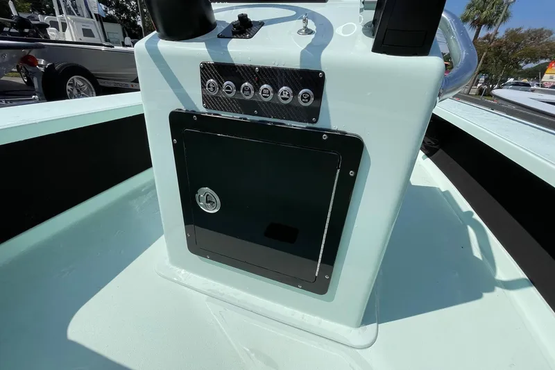 Slide: The Image of 2026 Chittum Skiffs Islamorada 18 boat dashboard with steering wheel and navigation system. - 15