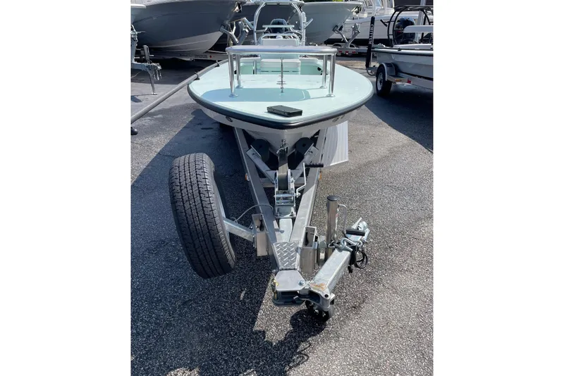 Slide: The Image of 2026 Chittum Skiffs Islamorada 18 boat, featuring sleek design and modern steering console. - 17