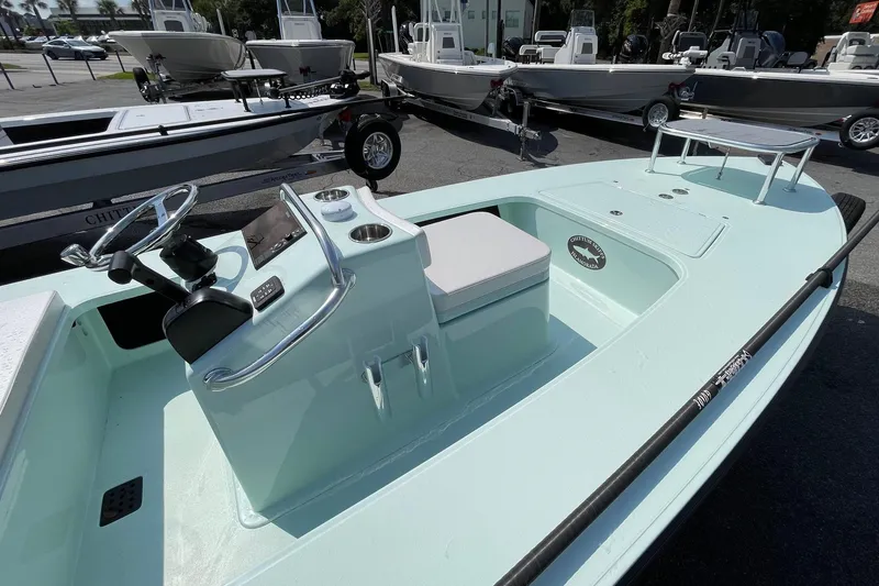 Slide: The Image of 2026 Chittum Skiffs Islamorada 18 on trailer, parked outdoors. - 18