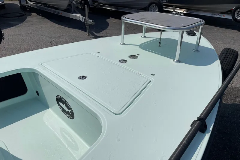 Slide: The Image of 2026 Chittum Skiffs Islamorada 18 boat, mint green, sleek design, outdoor display. - 19