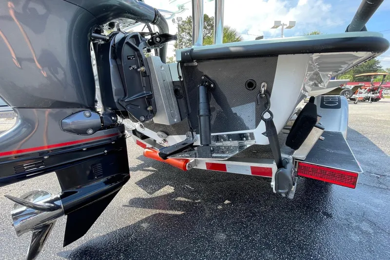 Slide: The Image of 2026 Chittum Skiffs Islamorada 18 interior with rod holders and sleek design. - 22