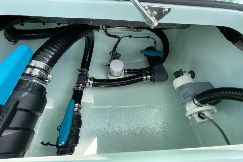 Slide: The Image of Open storage compartment on 2026 Chittum Skiffs Islamorada 18 boat, showcasing interior details. - 25