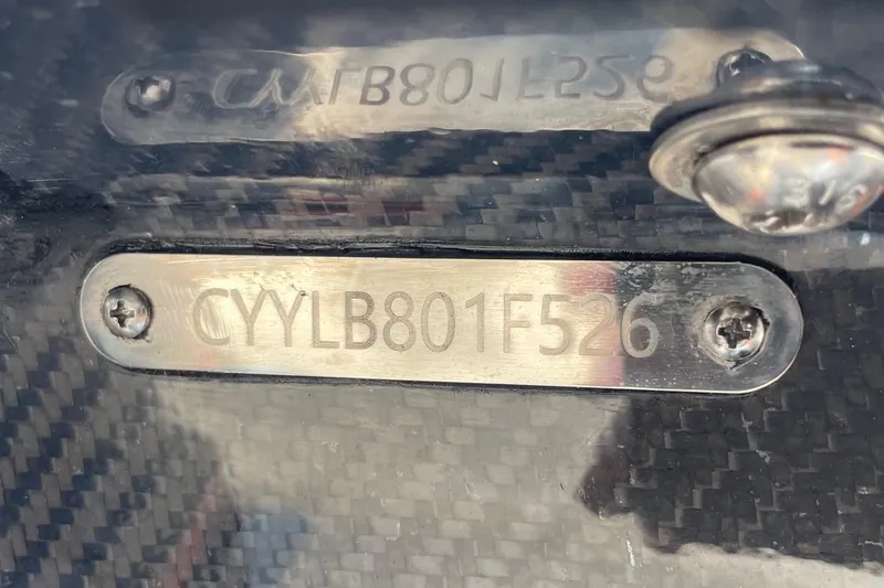 Slide: The Image of Battery compartment of 2026 Chittum Skiffs Islamorada 18 with wiring and components. - 32