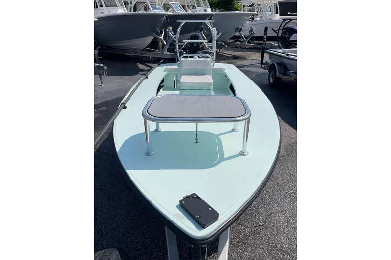 Slide: The Image of 2026 Chittum Skiffs Islamorada 18 boat on trailer, displayed outdoors. - 6