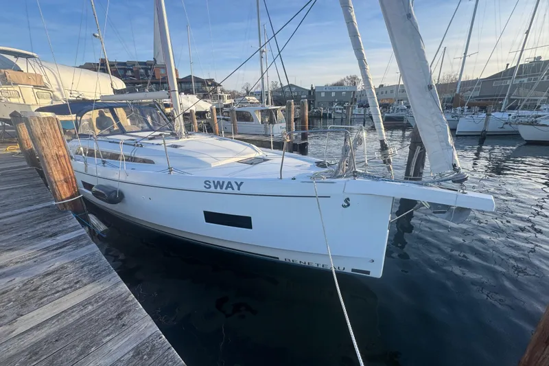 Slide: The Image of 2023 Beneteau Oceanis 40.1 sailboat docked at a marina, sunny day. - 5