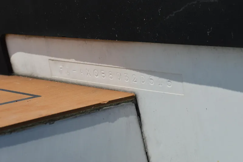 Slide: The Image of Hull identification number on 2015 Axopar T-Top boat, embossed on white surface. - 36
