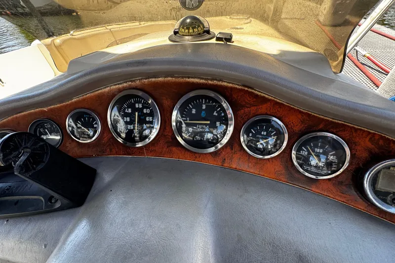 Slide: The Image of Dashboard of a 2000 Chaparral Sunesta 232 boat with gauges and compass. - 10