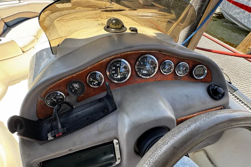 Slide: The Image of Dashboard of a 2000 Chaparral Sunesta 232 boat with gauges and Garmin device. - 15