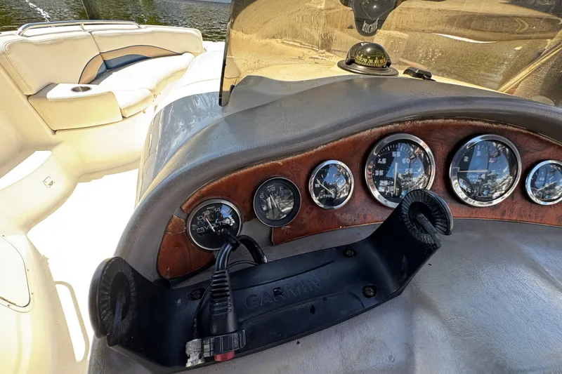 Slide: The Image of 2000 Chaparral Sunesta 232 boat dashboard with gauges and Garmin mount. - 16