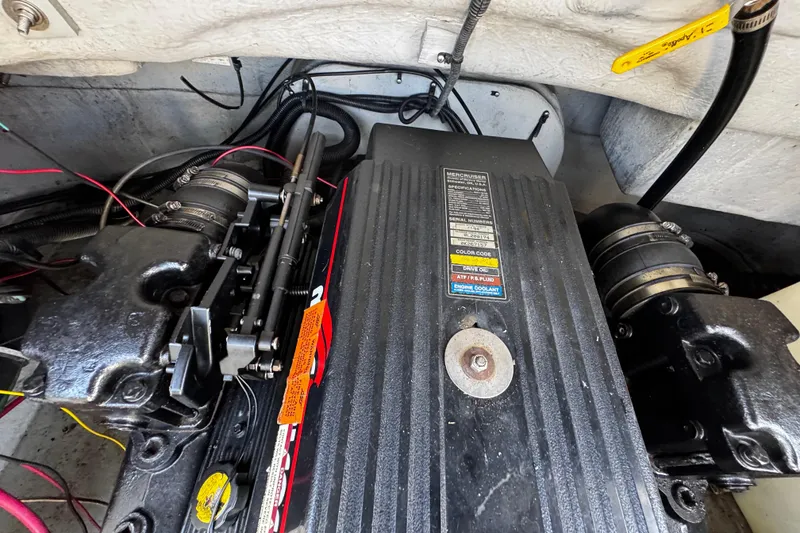 Slide: The Image of Engine compartment of 2000 Chaparral Sunesta 232 boat, featuring MerCruiser components. - 23