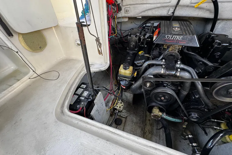 Slide: The Image of Engine compartment of a 2000 Chaparral Sunesta 232 boat, featuring a 5.7L V8 engine. - 25