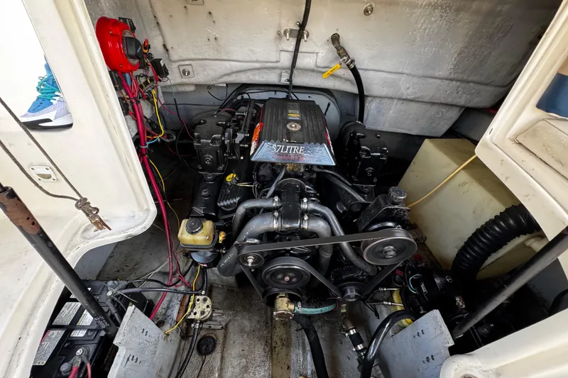 Slide: The Image of Engine compartment of 2000 Chaparral Sunesta 232 boat, showing detailed mechanical components. - 26