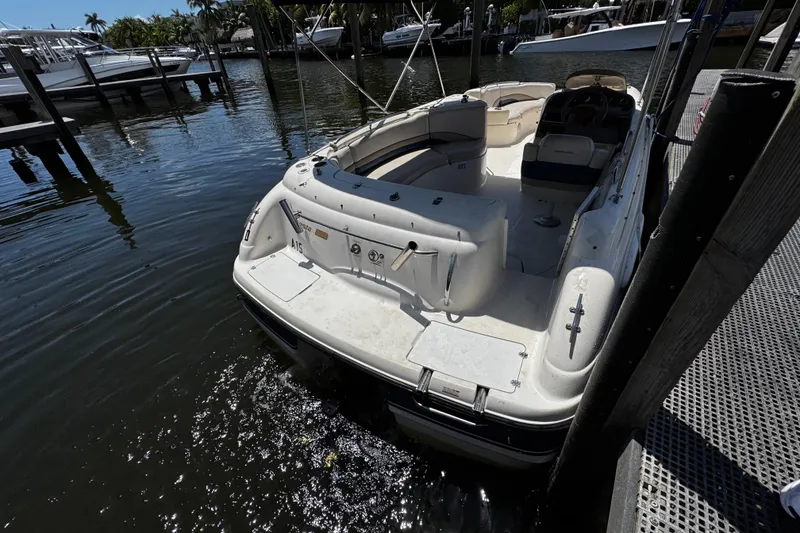 Slide: The Image of 2000 Chaparral Sunesta 232 boat docked in marina, rear view. - 8