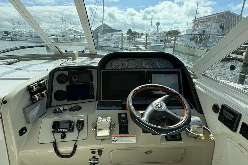 Slide: The Image of 2006 Sea Ray 40 Motor Yacht helm with steering wheel and navigation instruments. - 21