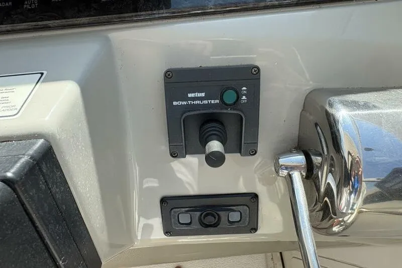 Slide: The Image of Control panel of 2006 Sea Ray 40 Motor Yacht with bow thruster joystick. - 24
