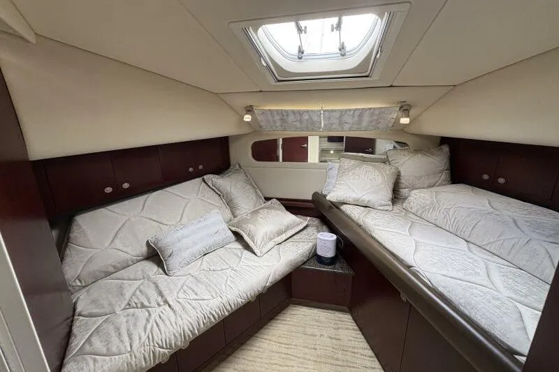Slide: The Image of Luxurious 2006 Sea Ray 40 Motor Yacht cabin with twin beds and skylight. - 29