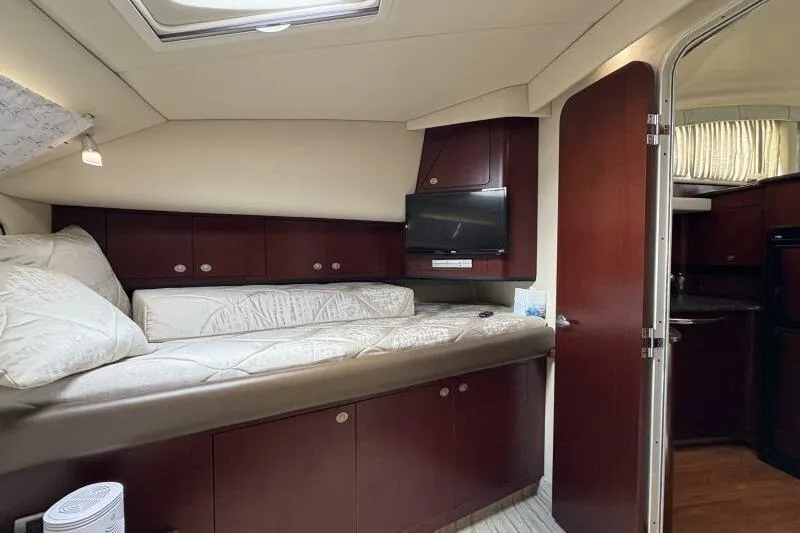 Slide: The Image of Interior of 2006 Sea Ray 40 Motor Yacht with cozy bed and TV. - 30