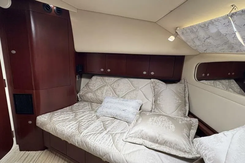 Slide: The Image of Luxurious cabin interior of 2006 Sea Ray 40 Motor Yacht with plush bedding. - 31