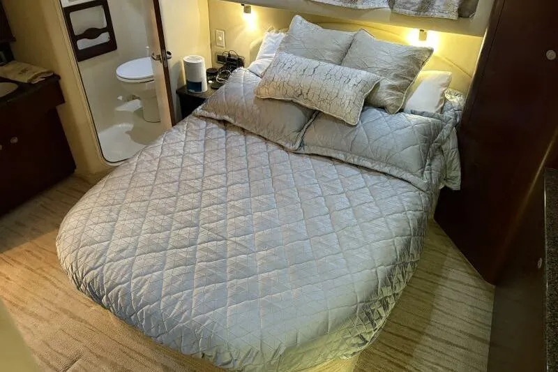 Slide: The Image of Luxurious bedroom interior of 2006 Sea Ray 40 Motor Yacht with cozy bedding. - 34