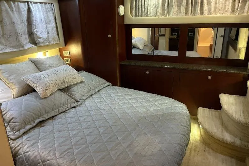 Slide: The Image of Luxurious bedroom interior of 2006 Sea Ray 40 Motor Yacht with cozy bedding and elegant decor. - 37