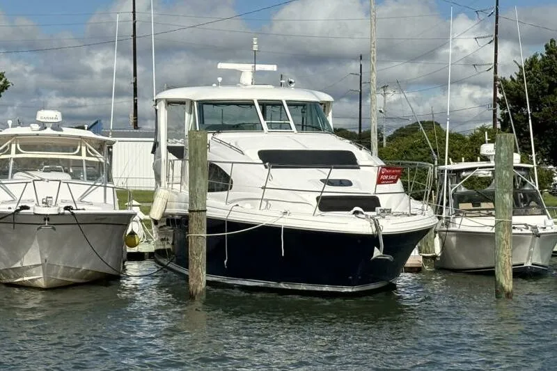 Slide: The Image of 2006 Sea Ray 40 Motor Yacht docked, for sale sign visible. - 4