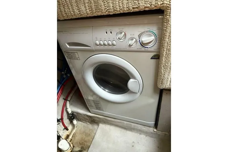 Slide: The Image of Washing machine inside 2006 Sea Ray 40 Motor Yacht, compact and efficient design. - 40