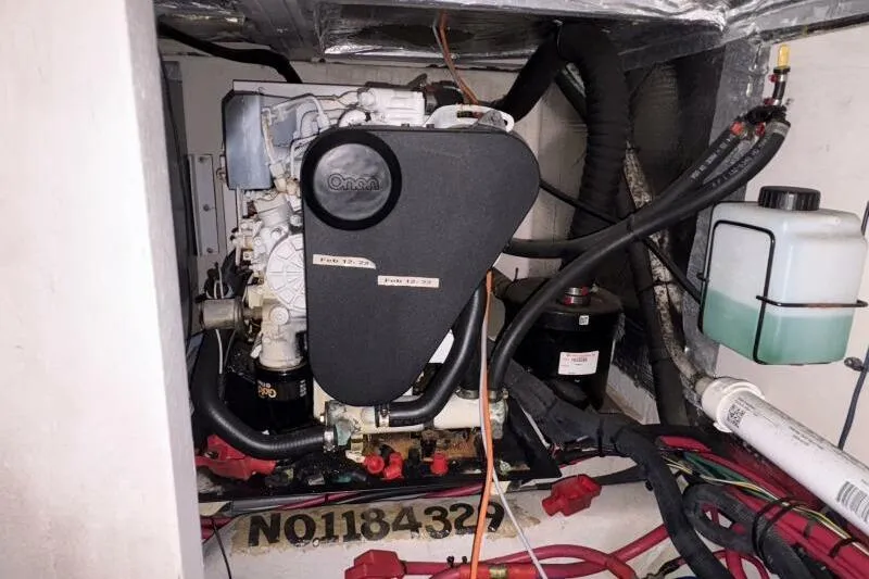 Slide: The Image of Engine compartment of a 2006 Sea Ray 40 Motor Yacht, featuring an Onan generator. - 44