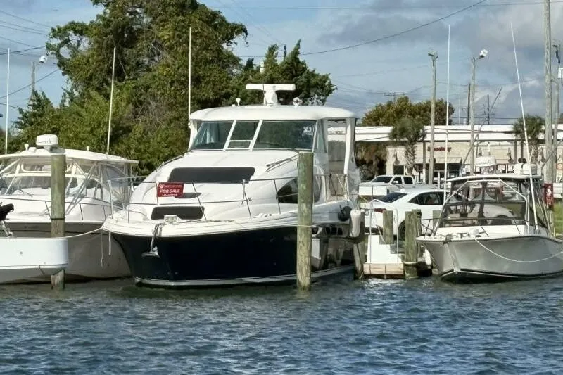 Slide: The Image of 2006 Sea Ray 40 Motor Yacht docked, for sale sign visible. - 5