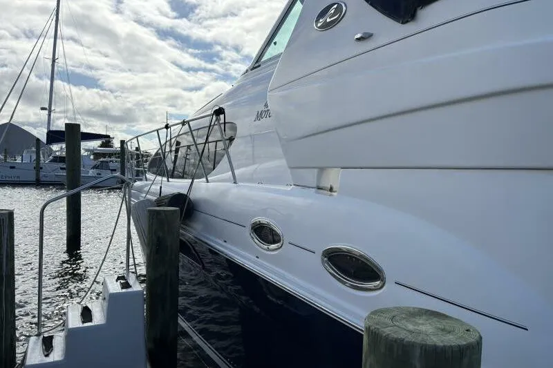 Slide: The Image of 2006 Sea Ray 40 Motor Yacht docked at marina under cloudy sky. - 6